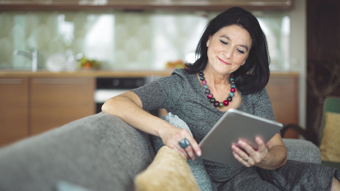 Woman reading Northwestern Mutual Market Commentary