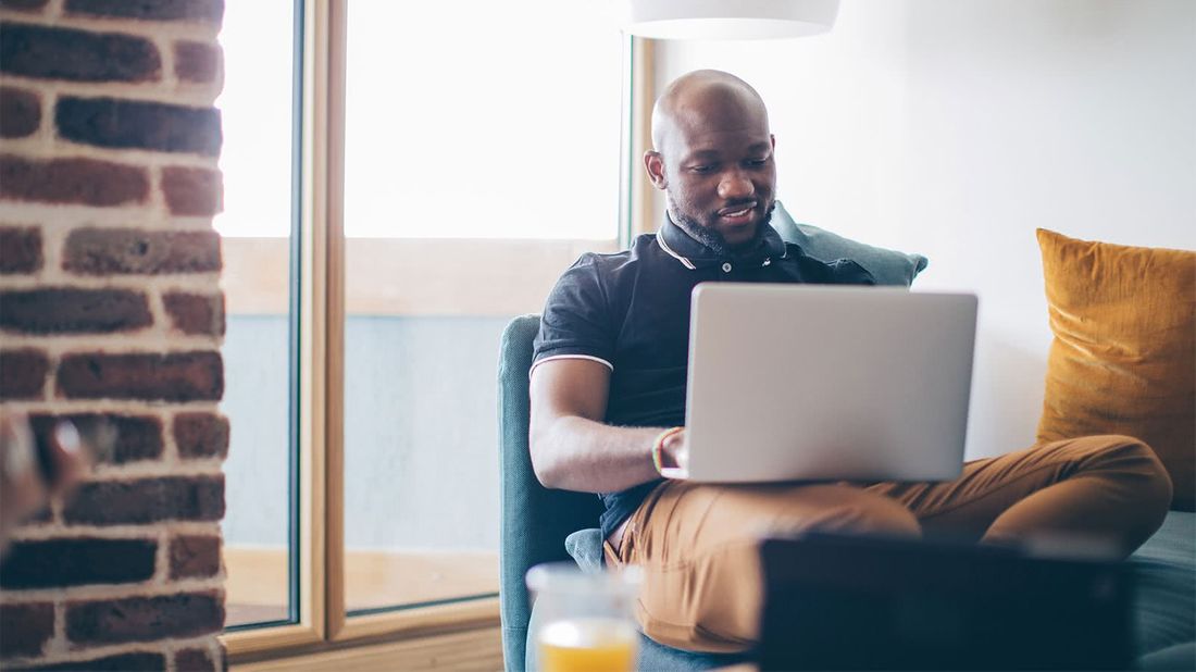 Man on laptop looking at his investment portfoilo