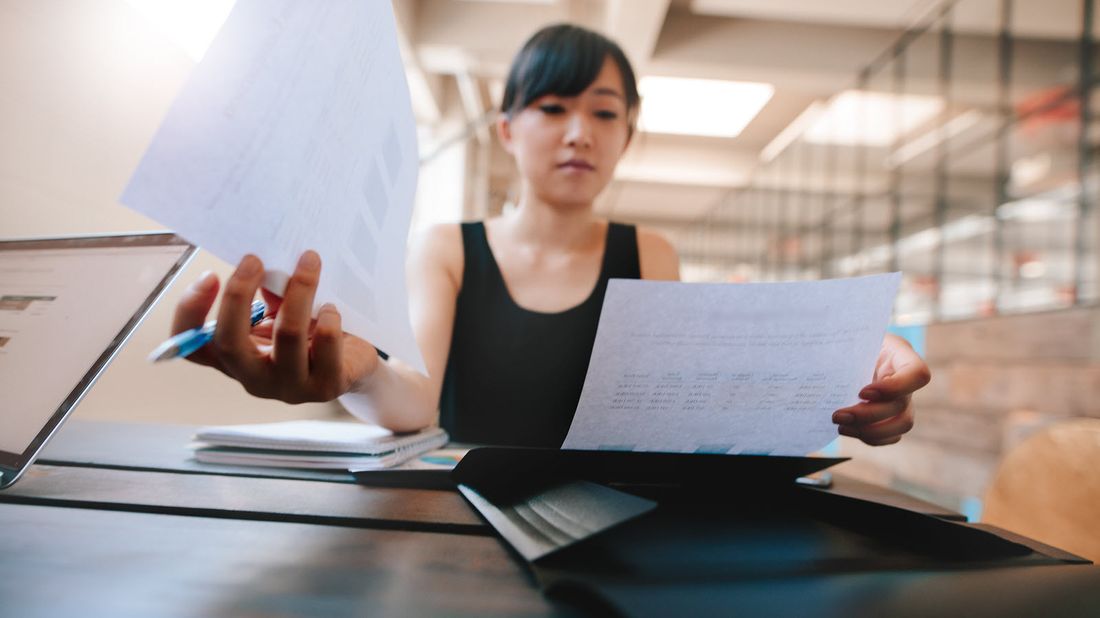 Woman looking at the new 2018 401(k) Contribution Limit