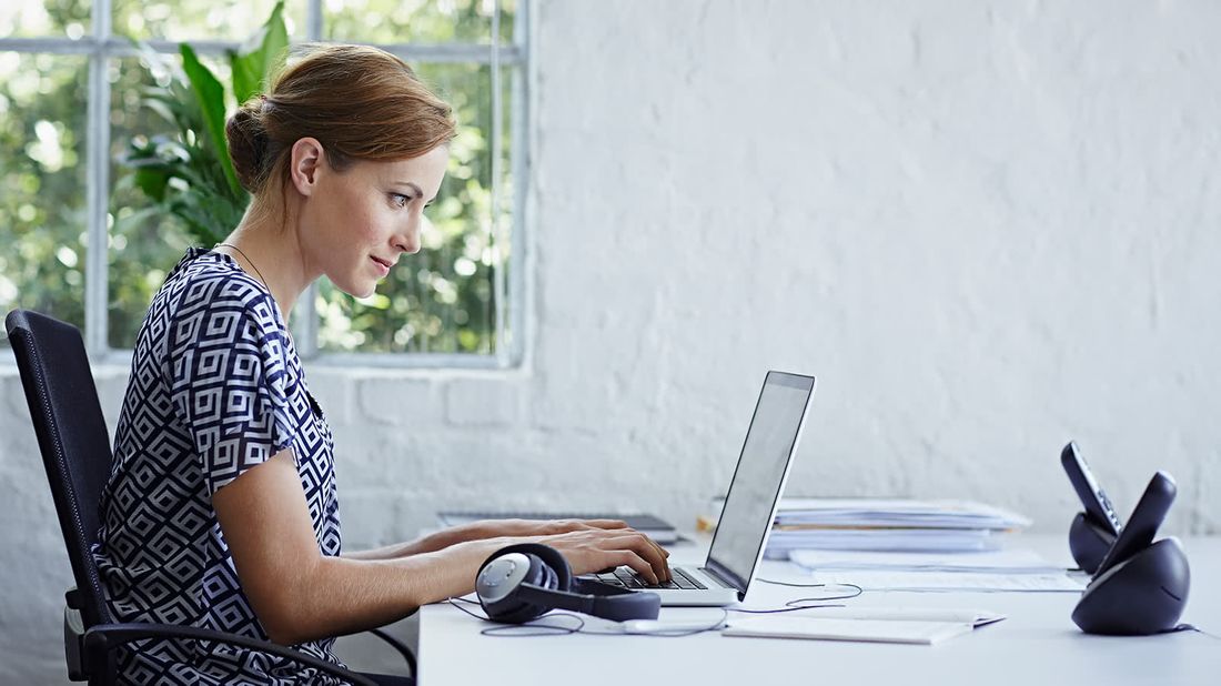 Woman checking her credit score on a computer