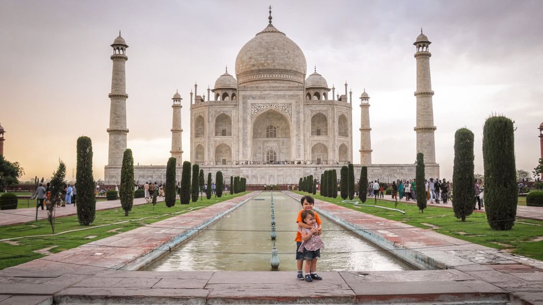 Kids on a trip around the world by the Taj Mahal