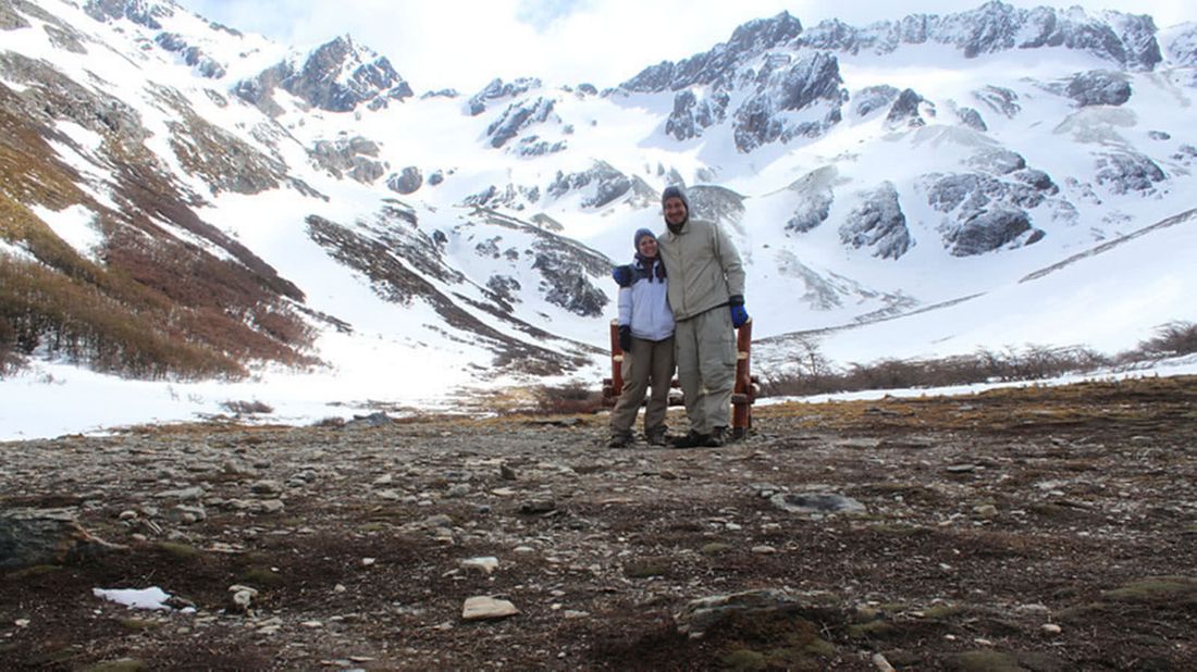 Couple on a glacier as they backpack through South America