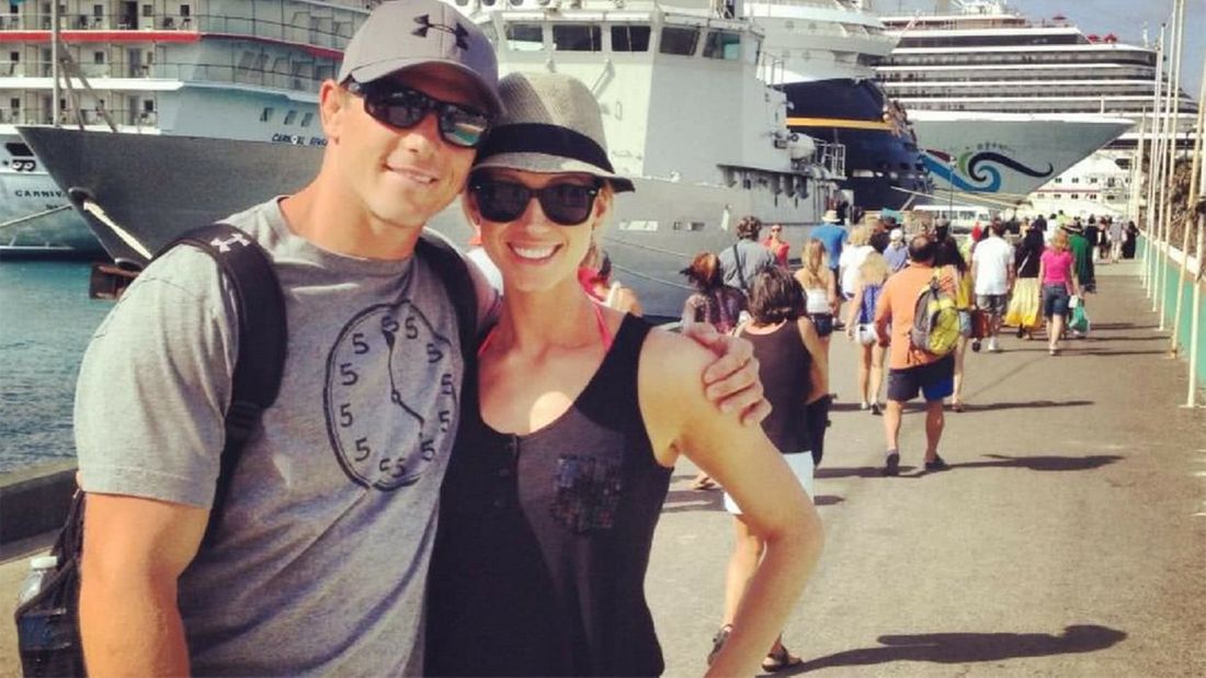 Couple by a cruise ship after taking control of their finances