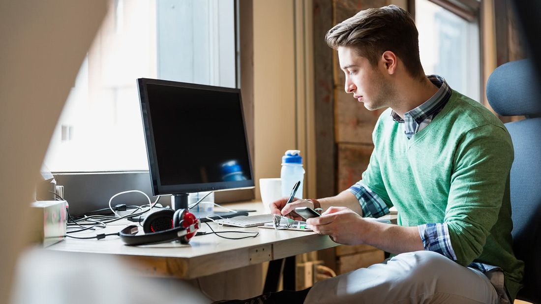 Man at his desk reading the new tax law changes