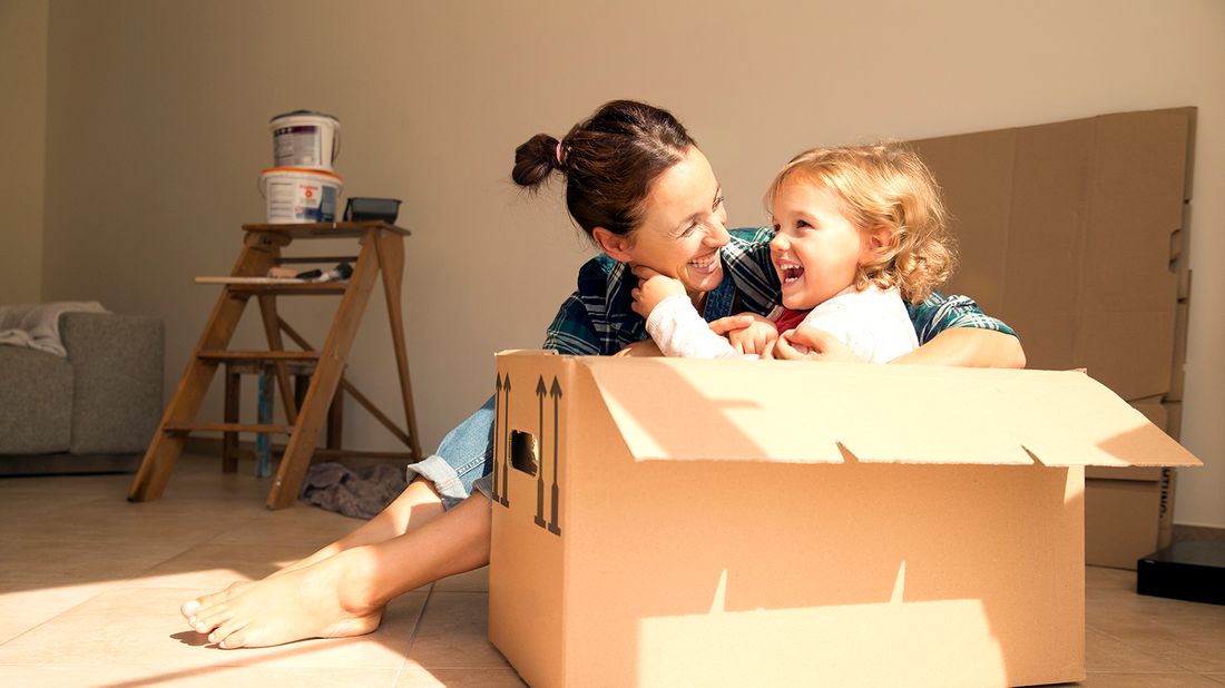 Mom with daughter in a moving box.