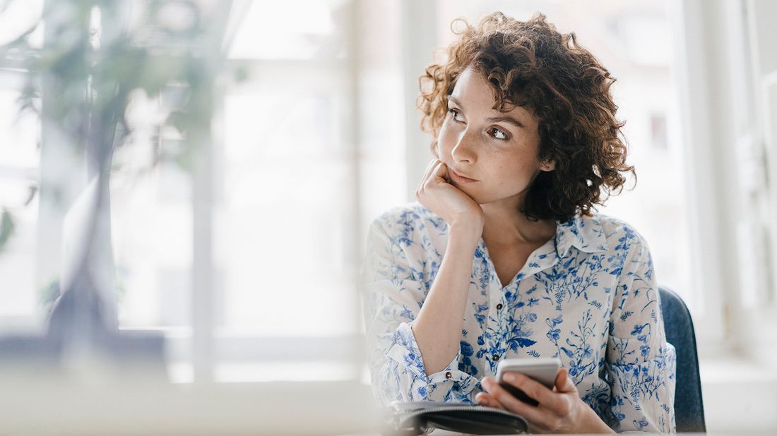 Woman thinking about quitting her job.