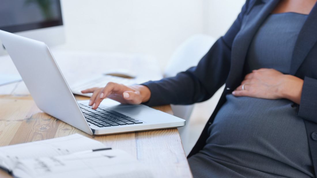 Pregnant freelancer preparing for maternity leave.