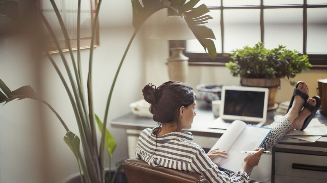 Woman with her feet up at a desk