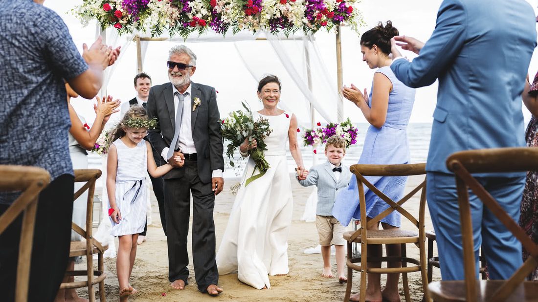 Beach wedding of older couple