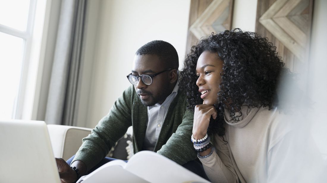 Couple looking at their interest rates.