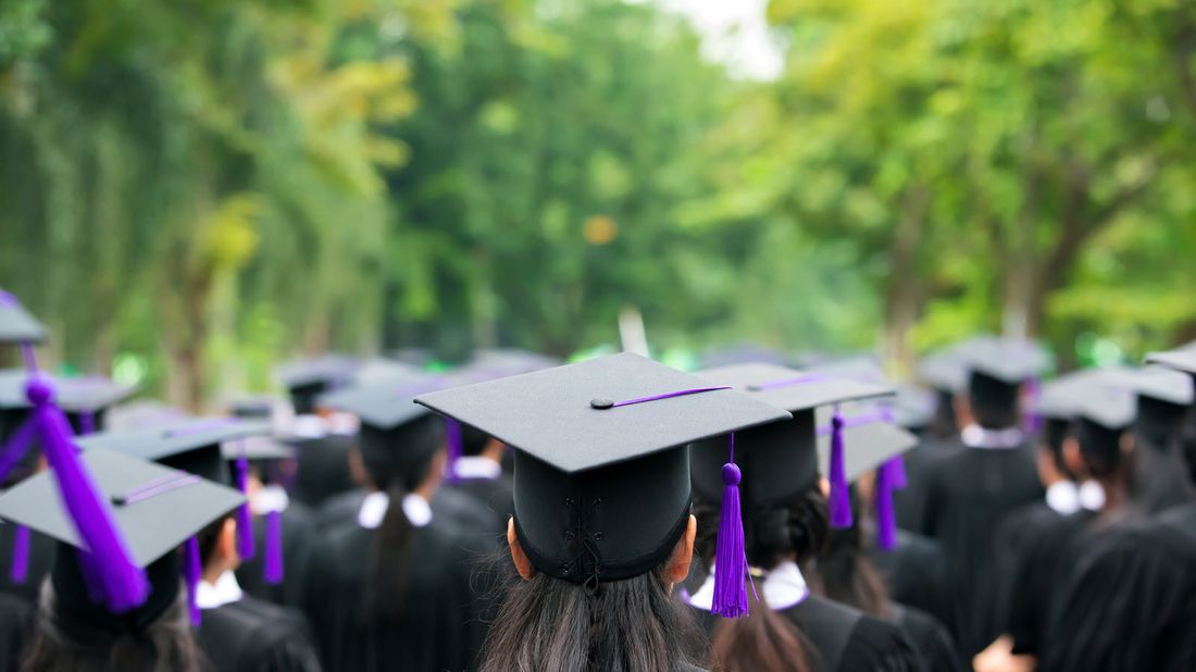 Graduates wearing their mortarboards.