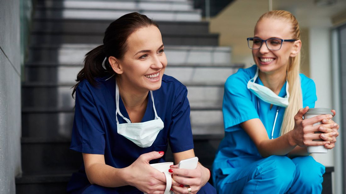 Two female surgeons taking a coffee break