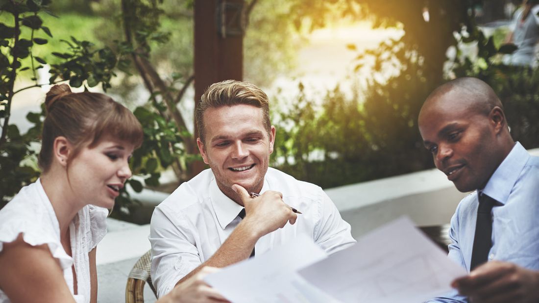 A young couple working with their adviser