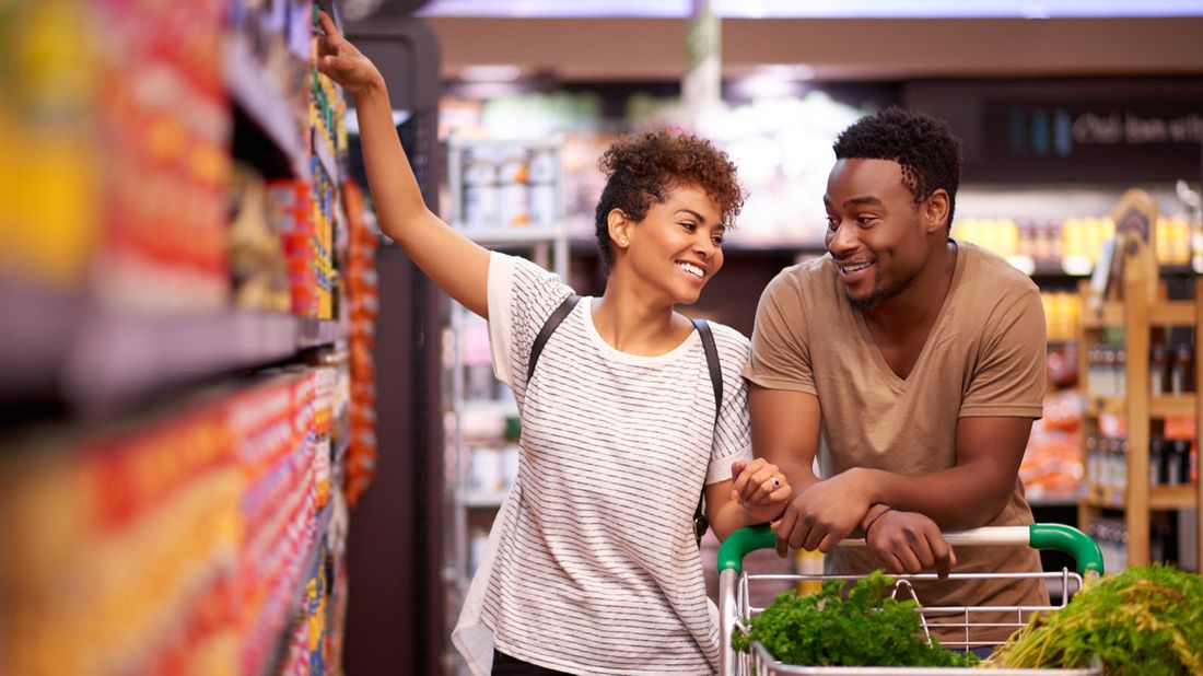 a couple shopping at the grocery store