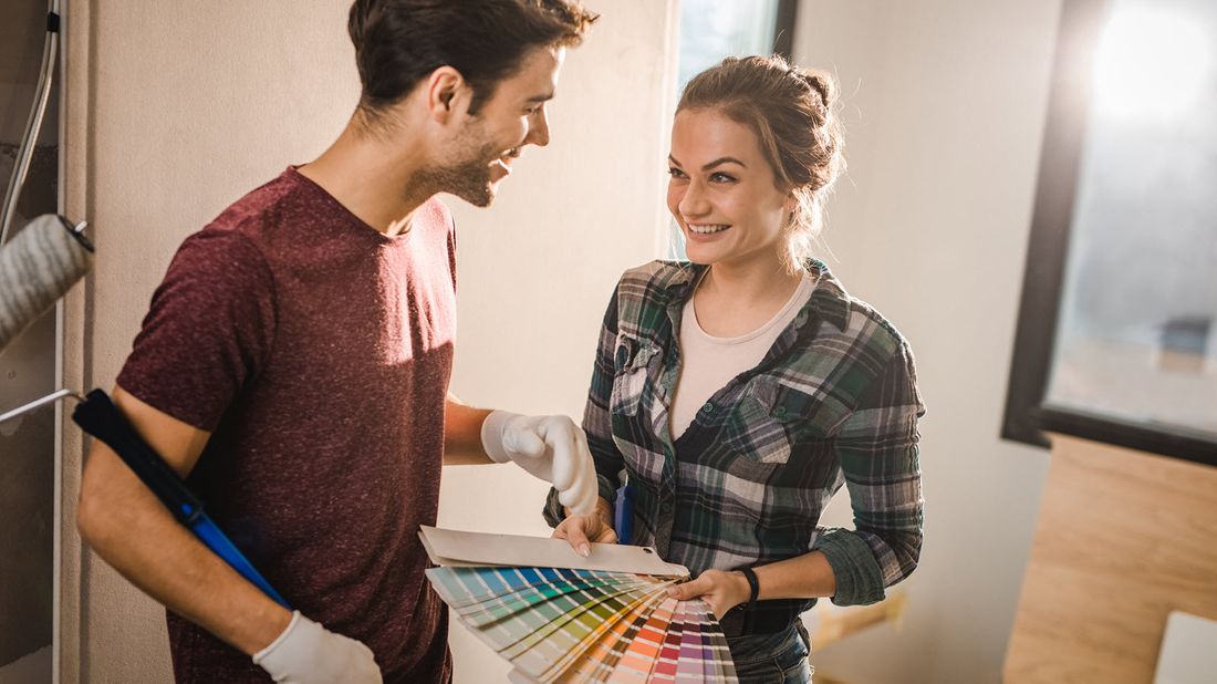 Couple picking paint colors for a home they’re building in a new development.