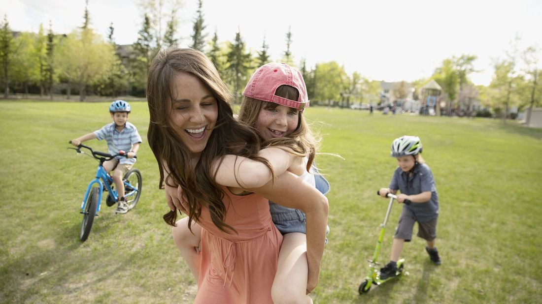 Mom with her kids in a park 