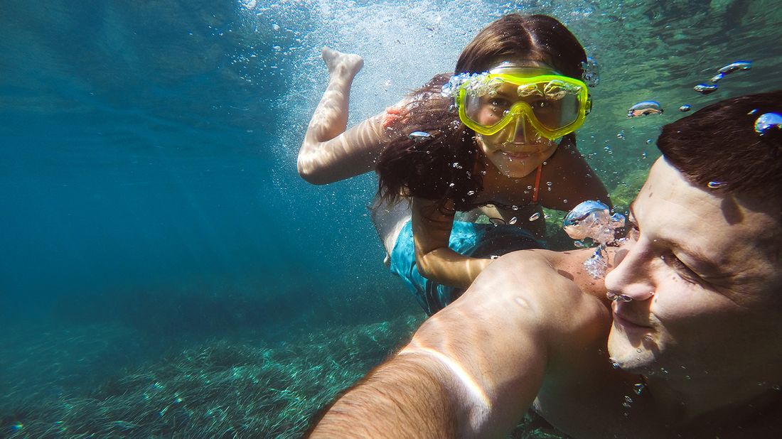 father and daughter swimming on spring break trip