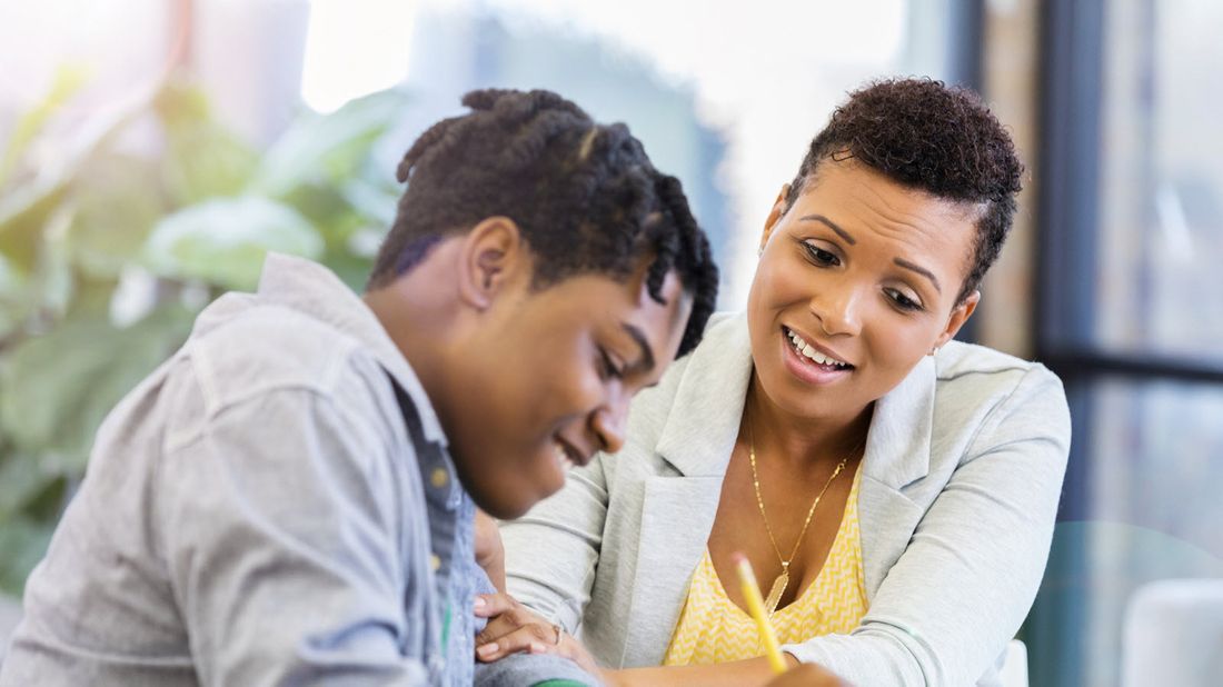 A mother and her son discussing college costs together