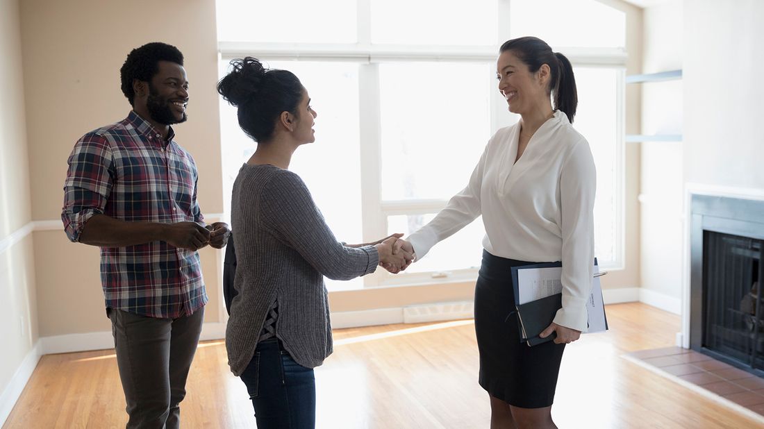 couple interviewing real estate agent