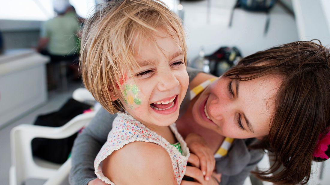 mom and daughter having fun on cruise vacation 