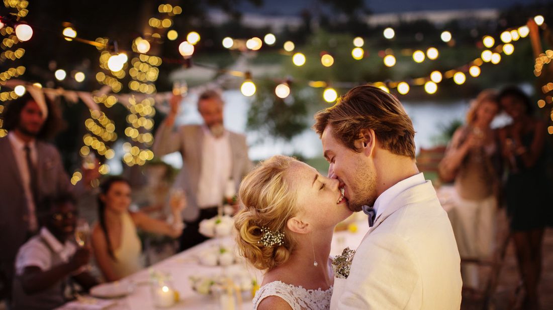 Young couple kissing during wedding