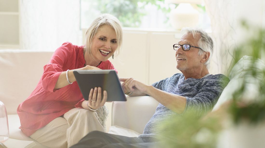 Couple discussing how to help recession proof their retirement savings.