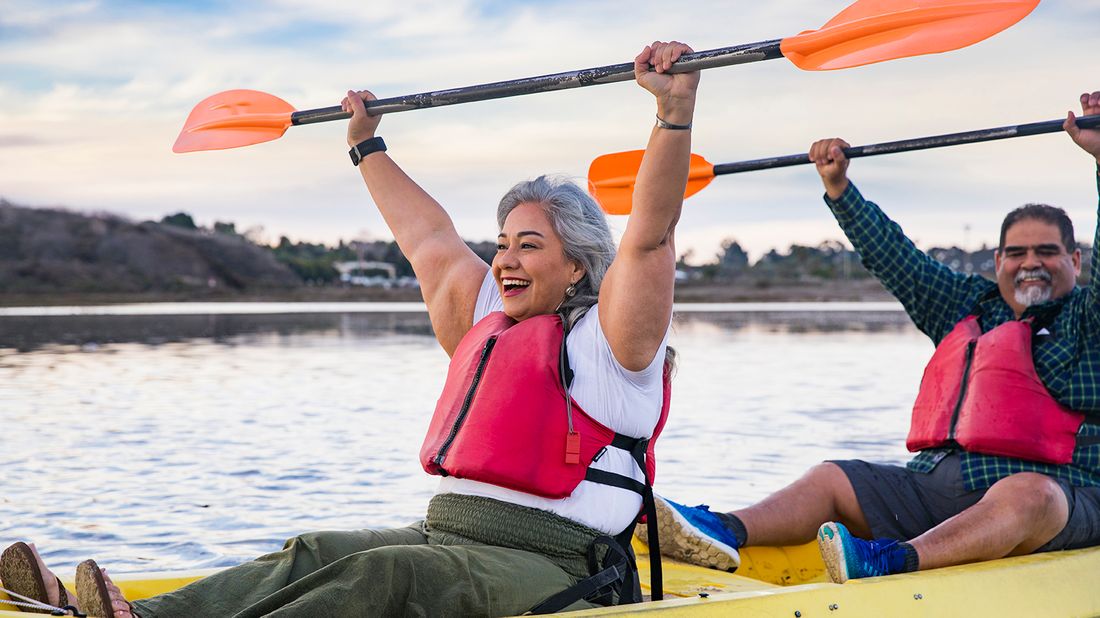 senior couple kayaking in retirement 