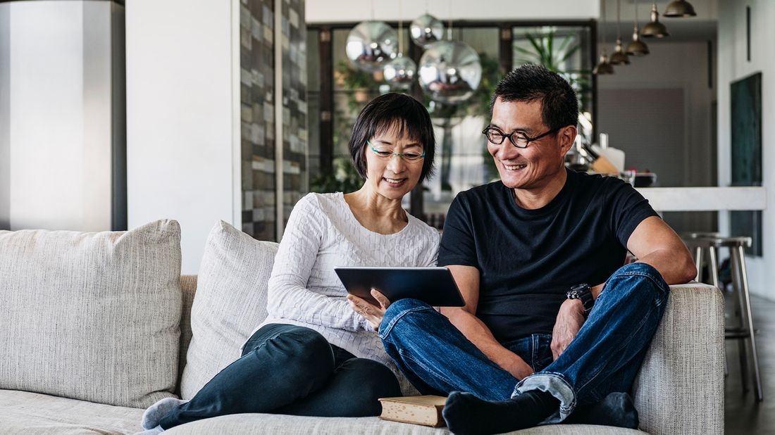 Couple looking at tablet wondering "what is an HSA?" 