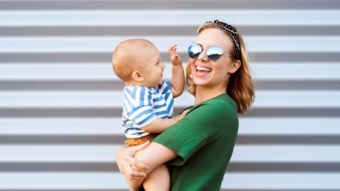 Mom and baby having fun and getting ready to enjoy splurges.