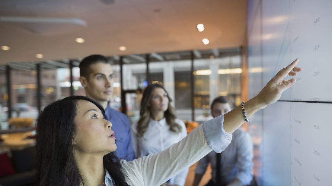 woman who learned tech skills for free running a meeting