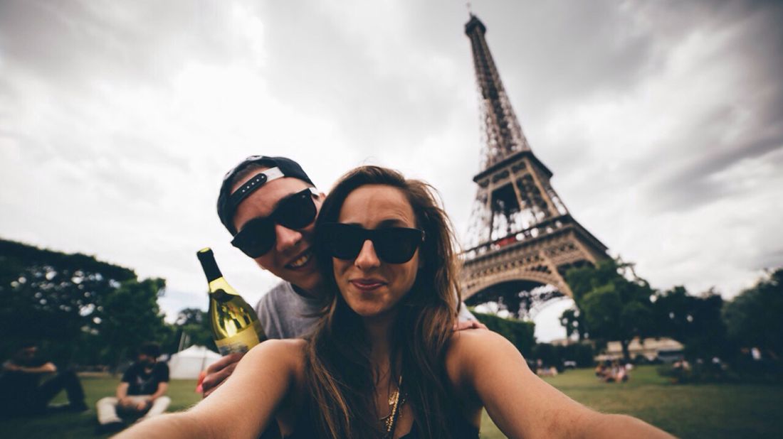 Young couple deciding to honeymoon in Paris.