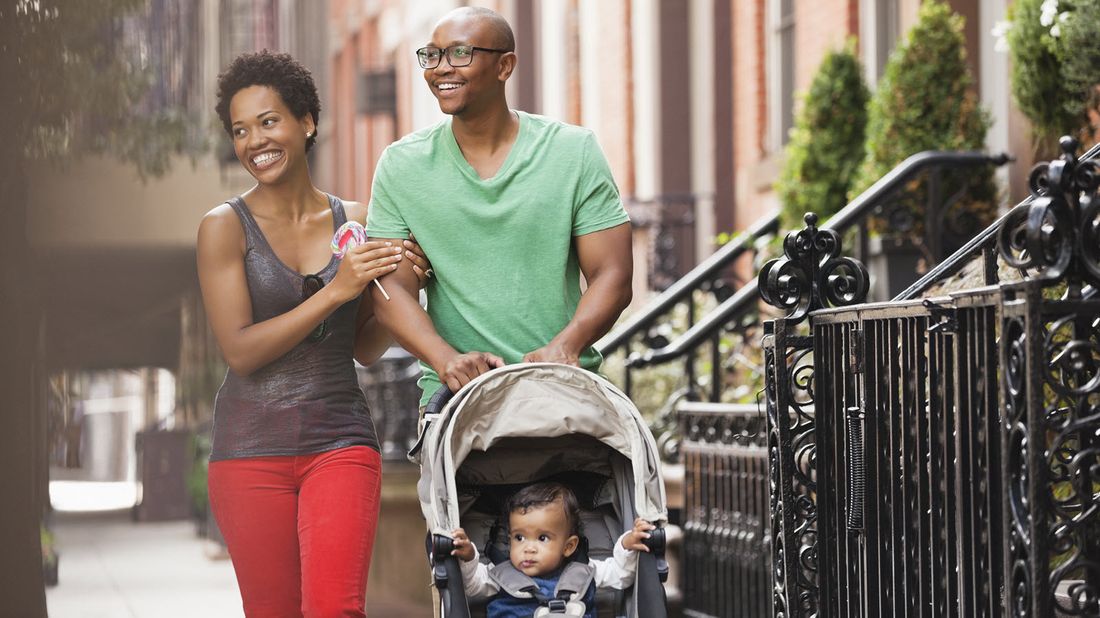 Family walking down street thinking about the critical role whole life insurance plays in their financial plan. 