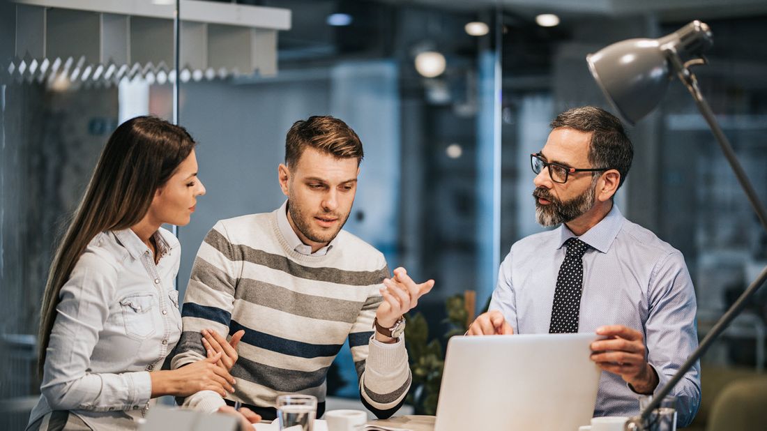 A young couple working with advisor to put assets in a trust