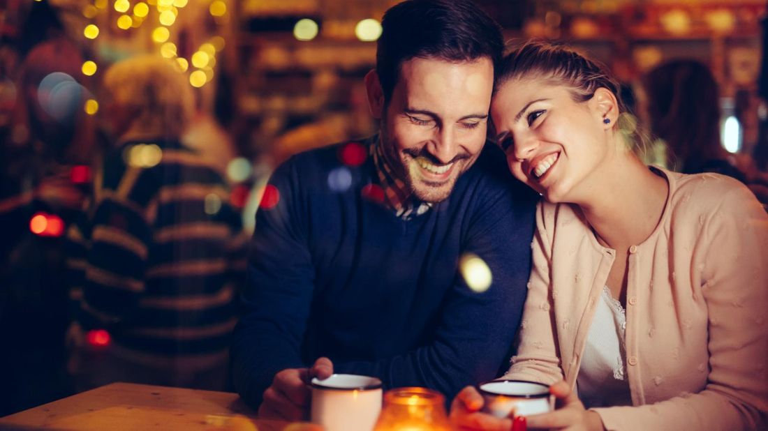 A couple on a date night buying happiness