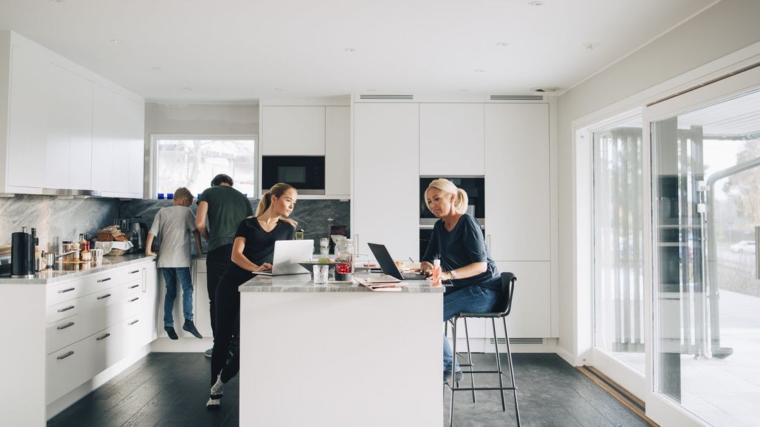 Mother talking to daughter as she helps prepare her for financial independence