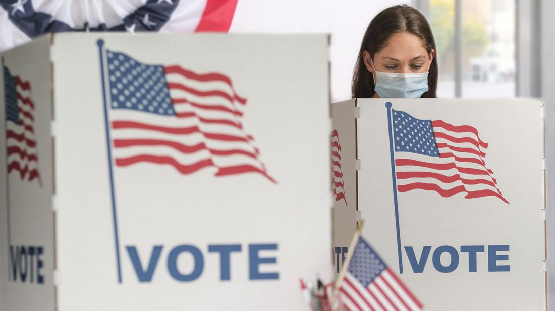 A woman votes in an election