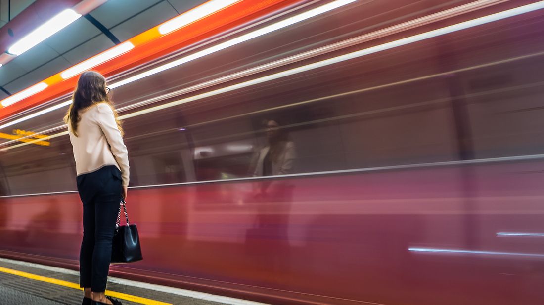 businesswoman waiting for train