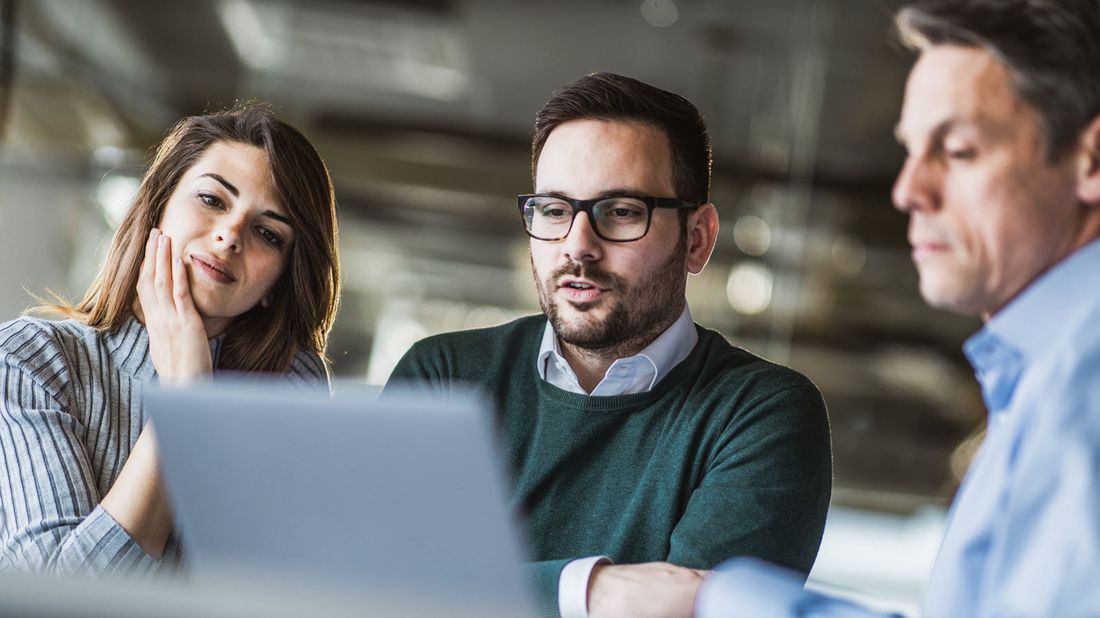 A couple revisiting their financial plan with an advisor