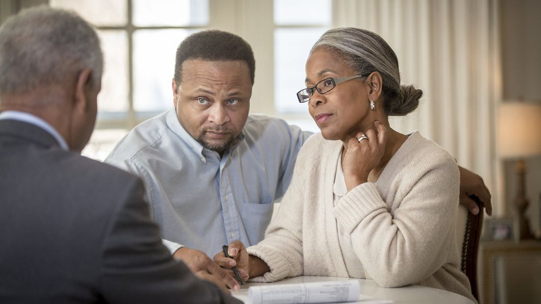 Couple meeting with financial advisor.