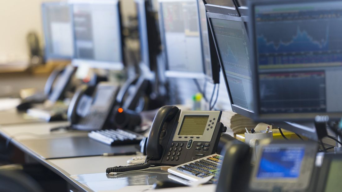 Phones at a trading desk.