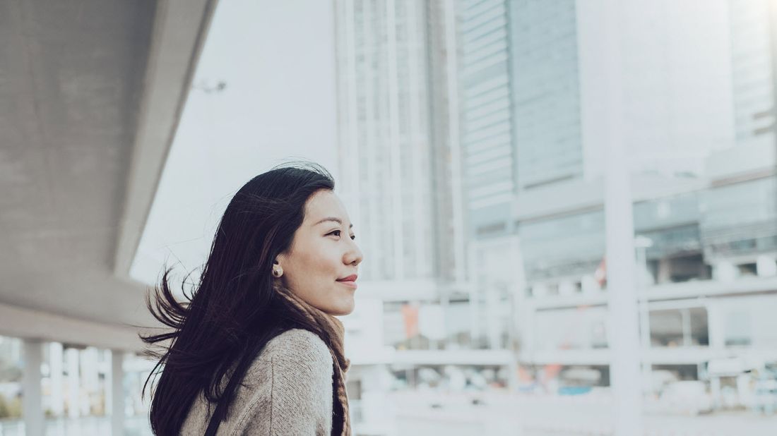 A woman looks to cross the street