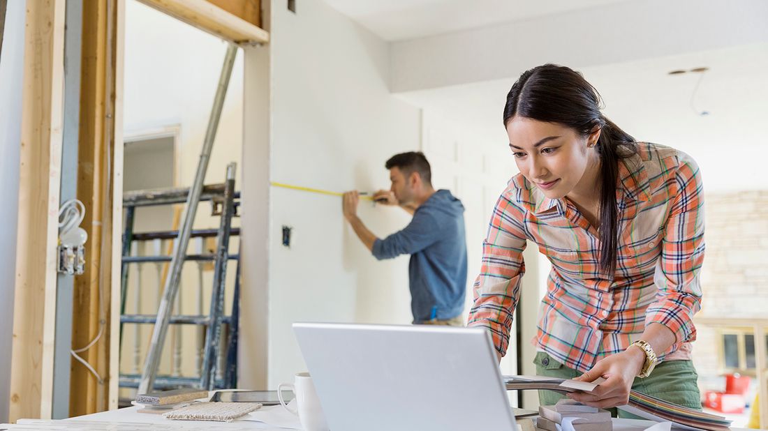 Young couple working on home renovations