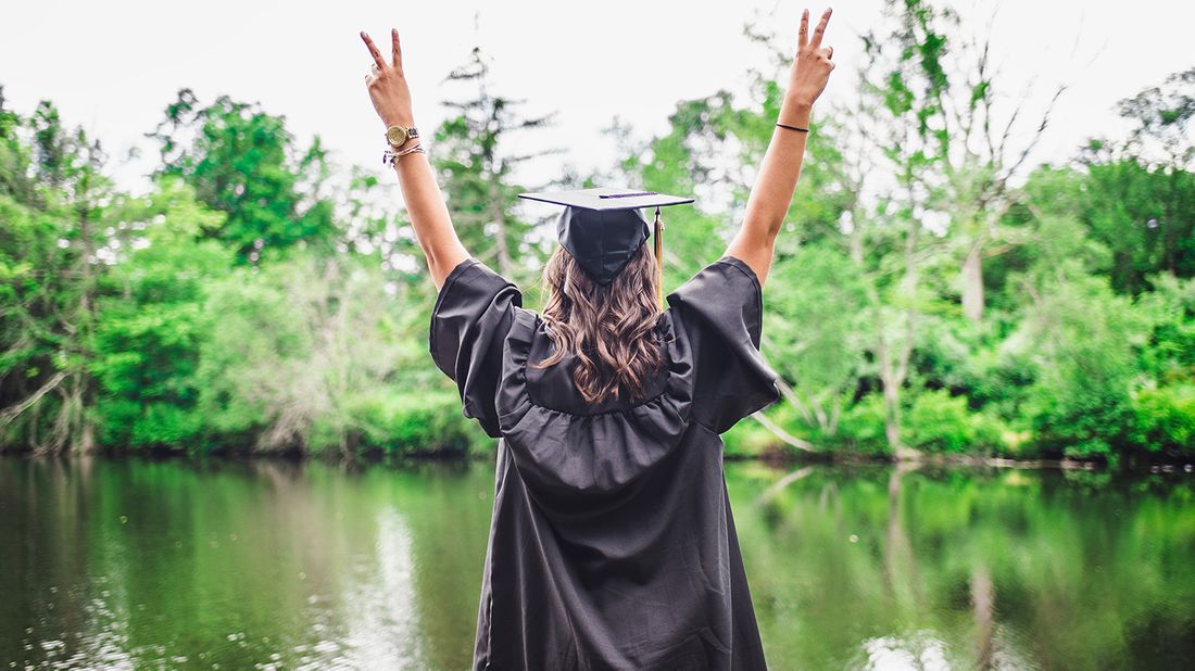 woman in graduation cap and gown