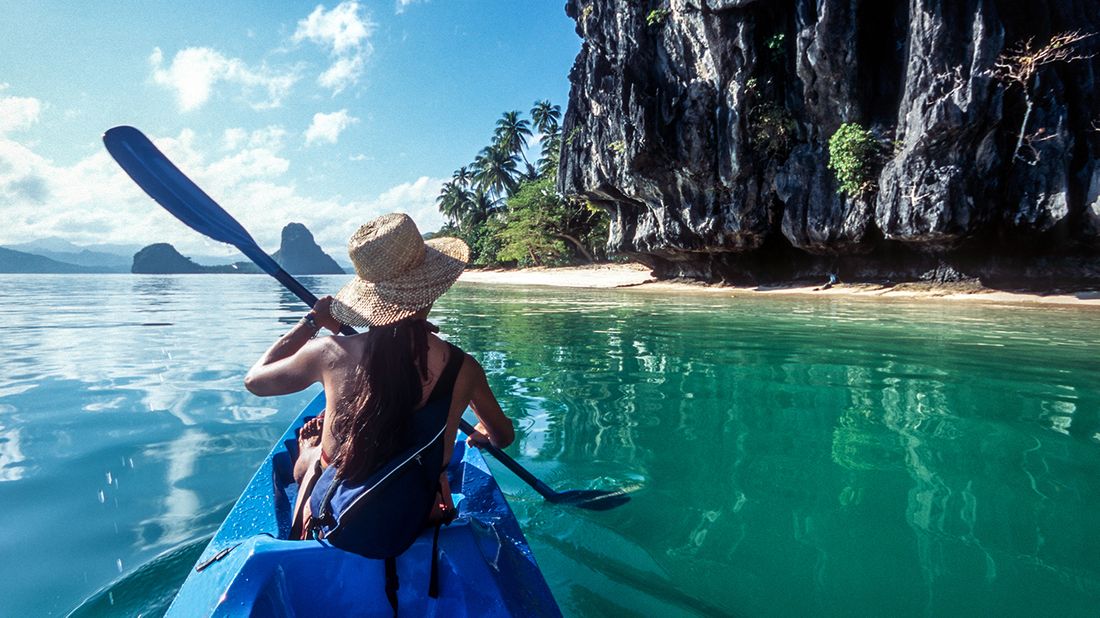 woman kayaking on vacation