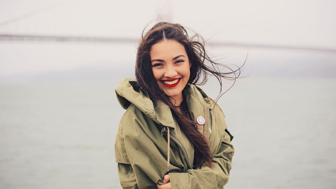 woman smiling near water