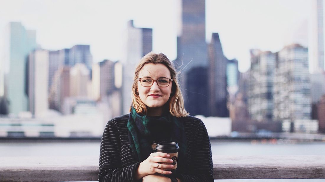 woman standing with city background