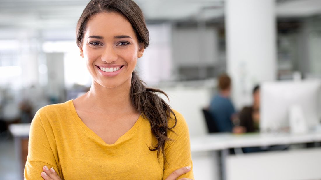 young woman standing in office