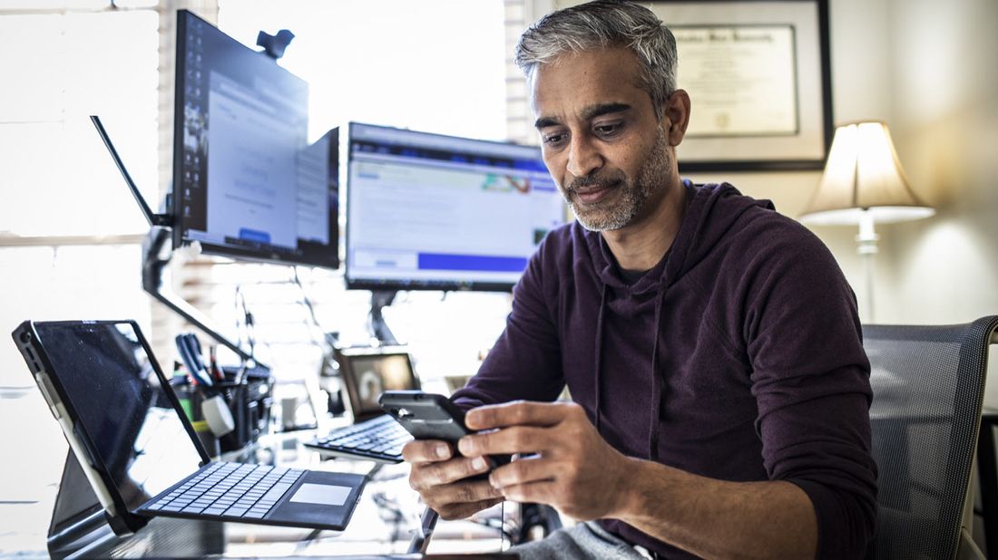 man looking at investment account