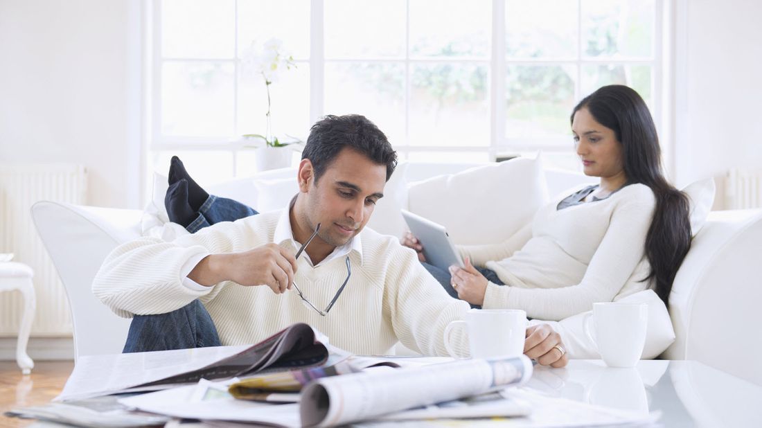 Man and woman reading Northwestern Mutual Market Commentary