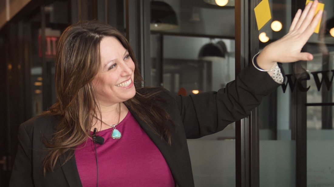 Entrepreneur Erica Wexler arranges post-it notes in her office